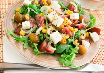 fresh vegetarian healthy vegetable salad with arugula and chees