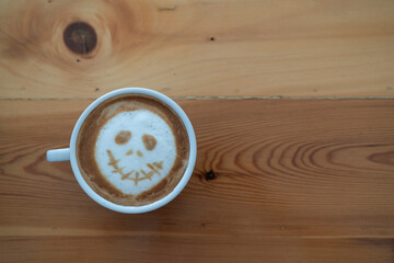 Cup of coffee with scary Jack's face. Halloween background. Halloween party.