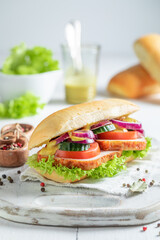 Tasty and fresh sandwich with roasted chicken, tomato and lettuce