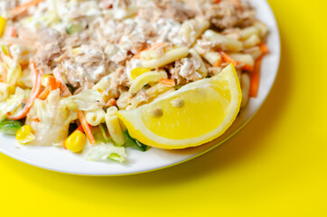 Cavatelli pasta with tuna and iceberg lettuce, carrots, sweet corn and cucumber in a sauce mayonnaise