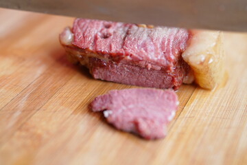Cooked horse meat on cutting board