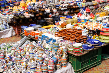 A street shop with oriental ceramics. Teapots, plates and bowls. Bowls, plates and tea cups in souvenir shop in Pune, India during Diwali Festival, Traditional ceramic pottery.