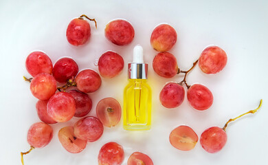 Cosmetics in a bottle in water, skin hydration concept. Hyaluronic acid. Selective focus.