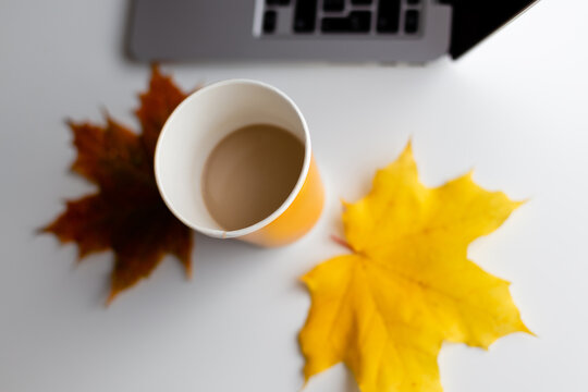 A Cup Of Coffee And An Autumn Leaf. Image From Above.