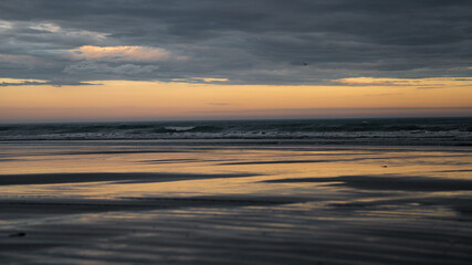 Fototapeta na wymiar Sunset ocean reflection at Hawke Bay in New Zealand