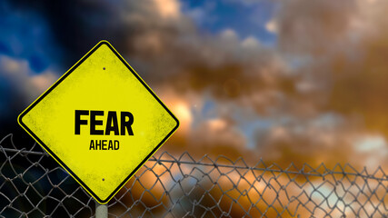 3D-Illustration of a yellow warning sign that says 'FEAR AHEAD' in front of a stormy sky