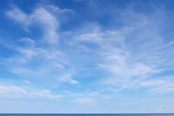 Beautiful blue sky with cirrus clouds over the sea. Skyline.