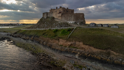 Fototapeta na wymiar Summer evening view of Lindisfarne Castle on Holy Island, Northumberland