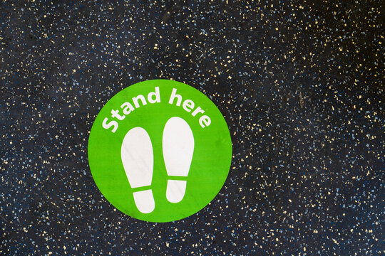 Stand here sticker on the floor to keep maintain social distancing. Covid-19 . Sydney trains