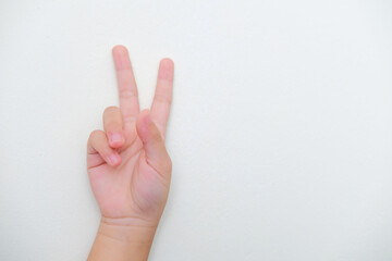 Kid hand pointing two finger up