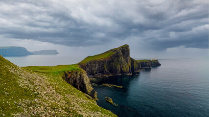 Overcast skies and gathering storm over Point of Neist Light House, Isle of Skye, Scotland