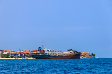Fototapeta premium Large industrial ship sailing in the Indian ocean near Zanzibar, Tanzania