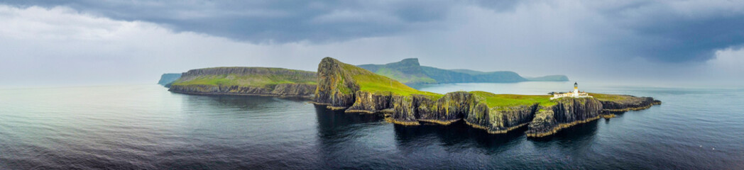Overcast skies and gathering storm over Point of Neist Light House, Isle of Skye, Scotland