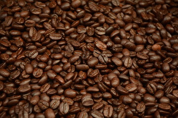Fototapeta premium Roasted coffee beans background. Coffee beans in front of spice shop in the Turkish bazaar in Akko (Acre) in Israel