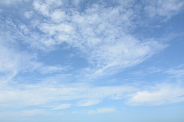 Unusual cirrus clouds in the blue sky. Beautiful sky background.