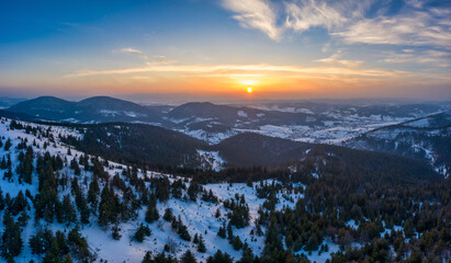 Picturesque winter panorama of snowy mountain hills