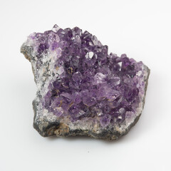 natural violet amethyst druse cluster on the white background