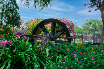 Historic Water Wheel surrounded by Flower Garden