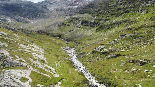 massive mountain rocks, aerial flight over swiss alps