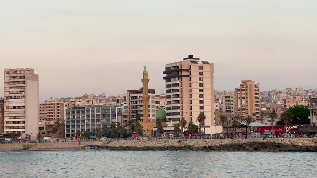 The city of Sidon in Lebanon. Sidon Sea Castle, built by the crusaders - Saida corniche and building. Sidon sea at sunset