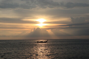 Naklejka na ściany i meble Sunset in a boat