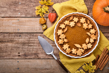 Pumpkin Pie. Tart with whipped cream and cinnamon on rustic background. Traditional american homemade pumpkin cake for Thanksgiving or Halloween Ready to eat. Mock up.