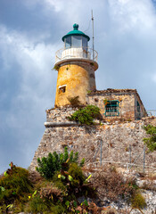 Fototapeta na wymiar Kerkyra. Greece. Old stone lighthouse in the old fort.