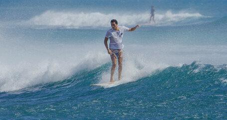 Surfer surfing on a longboard