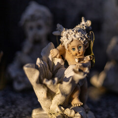 little beautiful angels on the tombs - obrazy, fototapety, plakaty