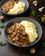 Beef Stroganoff with mushrooms and mashed potatoes.