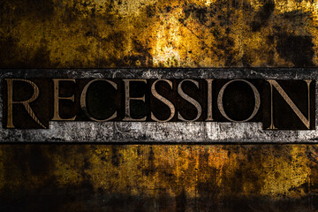Recession text on textured grunge copper and vintage gold background
