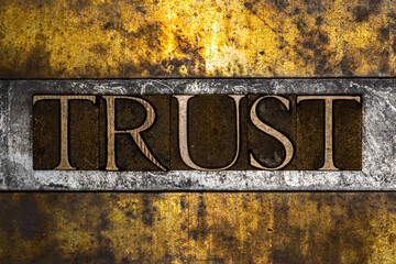 Trust text message on textured grunge copper and vintage gold background