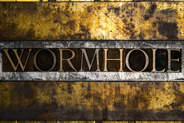 Wormhole text on vintage textured copper and gold background