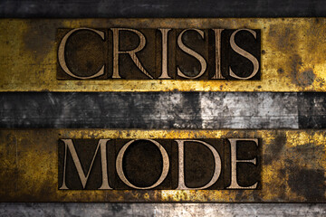 Crisis Mode text on vintage textured grunge lead copper and gold bar background