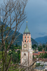 Fototapeta premium View of Merano in South Tyrol with the parish church of St. Nicholas from the 14th and 15th centuries - Italy.