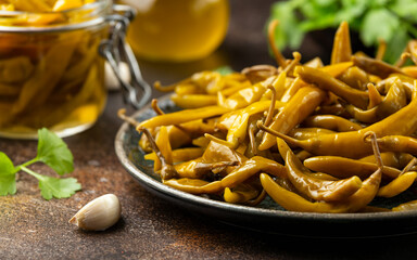 Homemade Pickled Green Chillies on plate. Healthy hot food