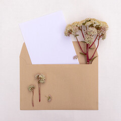 Postcard with a bouquet of wildflowers in an envelope with copy space