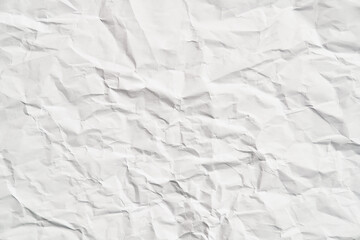 White crumpled paper texture with wrinkles. Damaged and torn sheet