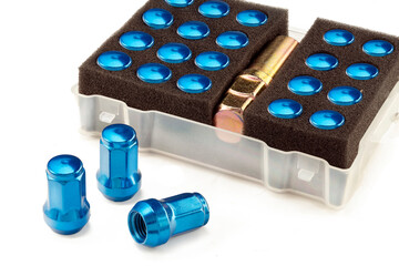 a set of colored blue wheel nuts. auto tuning and car maintenance, beautiful fasteners for alloy wheels