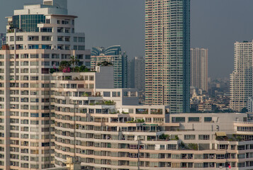 Bangkok, Thailand - Jan 18, 2020 : Beautiful Split-level Condominiums with intersecting levels with blue sky at Chao Phraya River, Cityscape.