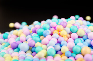 Foam beads of various colors brightly colored.