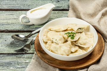 Dumplings with cottage cheese and sour cream