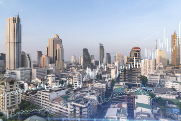 Fototapeta premium Financial stock chart hologram over panorama city view of Bangkok, business center in Southeast Asia. The concept of international transactions. Double exposure.