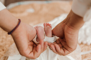 little baby feet baby on fathers arm