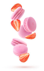 Isolated strawberry macarons. Falling pink macaroons and pieces of fresh strawberries isolated on white background