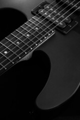 Fototapeta na wymiar Electric guitar close up. Black and white picture.