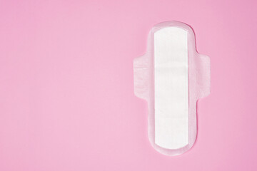 cotton sanitary pad napkin on pink background, copy space