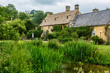 Fototapeta na wymiar The beautiful village of Lower Slaughter in the Cotswolds in Gloucestershire, England