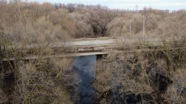 An old, destroyed automobile bridge over the Upa River.