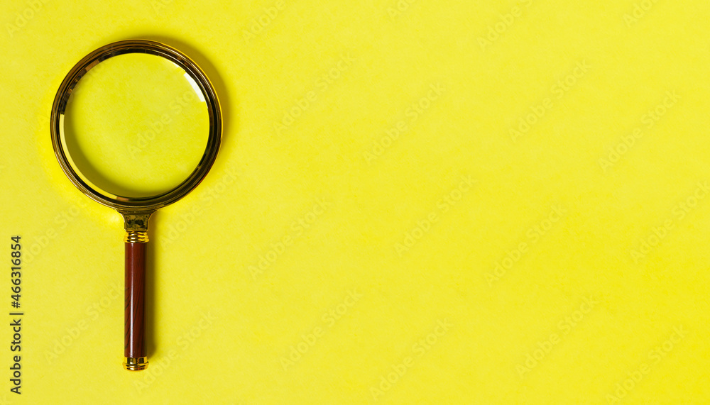 Poster magnifier as search symbol on minimal yellow background with copy space. banner with magnifying tool